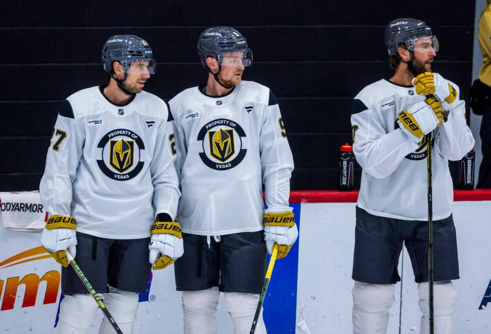 Golden Knights defenseman Shea Theodore (27), center Jack Eichel (9) and defenseman Alex Pietra ...