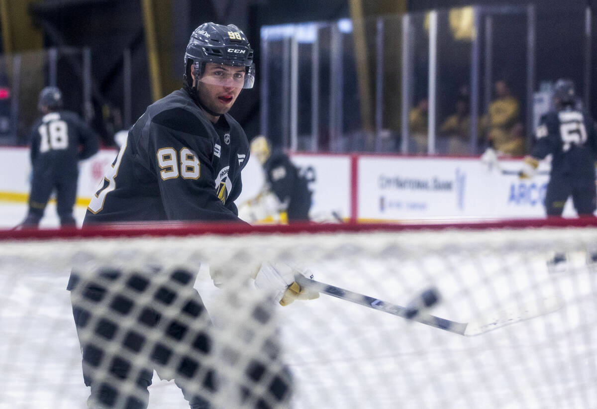 Golden Knights forward Mikael Huchette (98) takes a shot on goal during the first day of traini ...