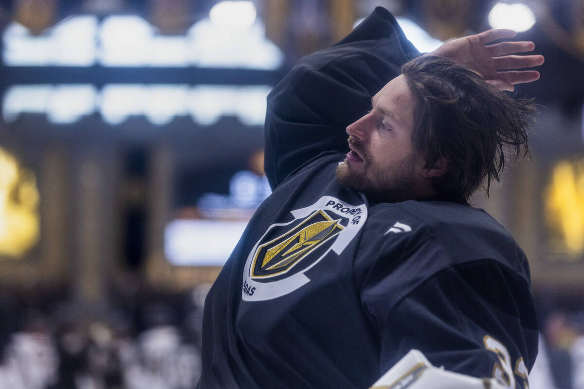 Golden Knights goaltender Adin Hill (33) readies to put on his helmet during the first day of t ...