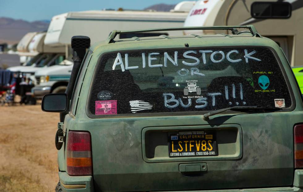 Sign on the rear window of a car during the Alienstock festival on Friday, Sept. 20, 2019 in Ra ...