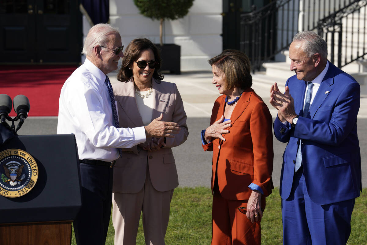 U.S. President Joe Biden, with Vice President Kamala Harris, greets House Speaker Nancy Pelosi ...