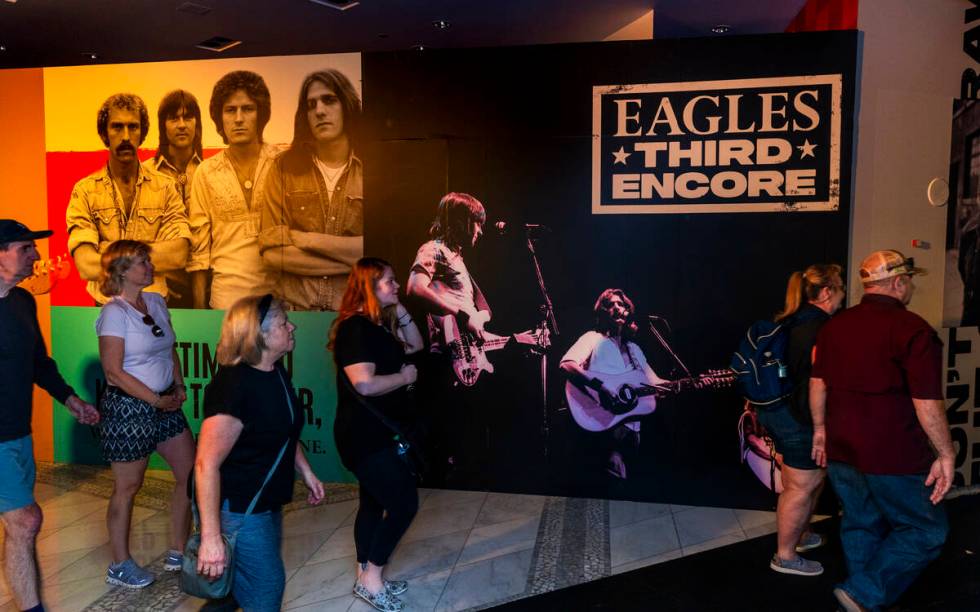 Fans walk along the entry way to the Eagles exclusive fan experience Third Encore debuting toda ...