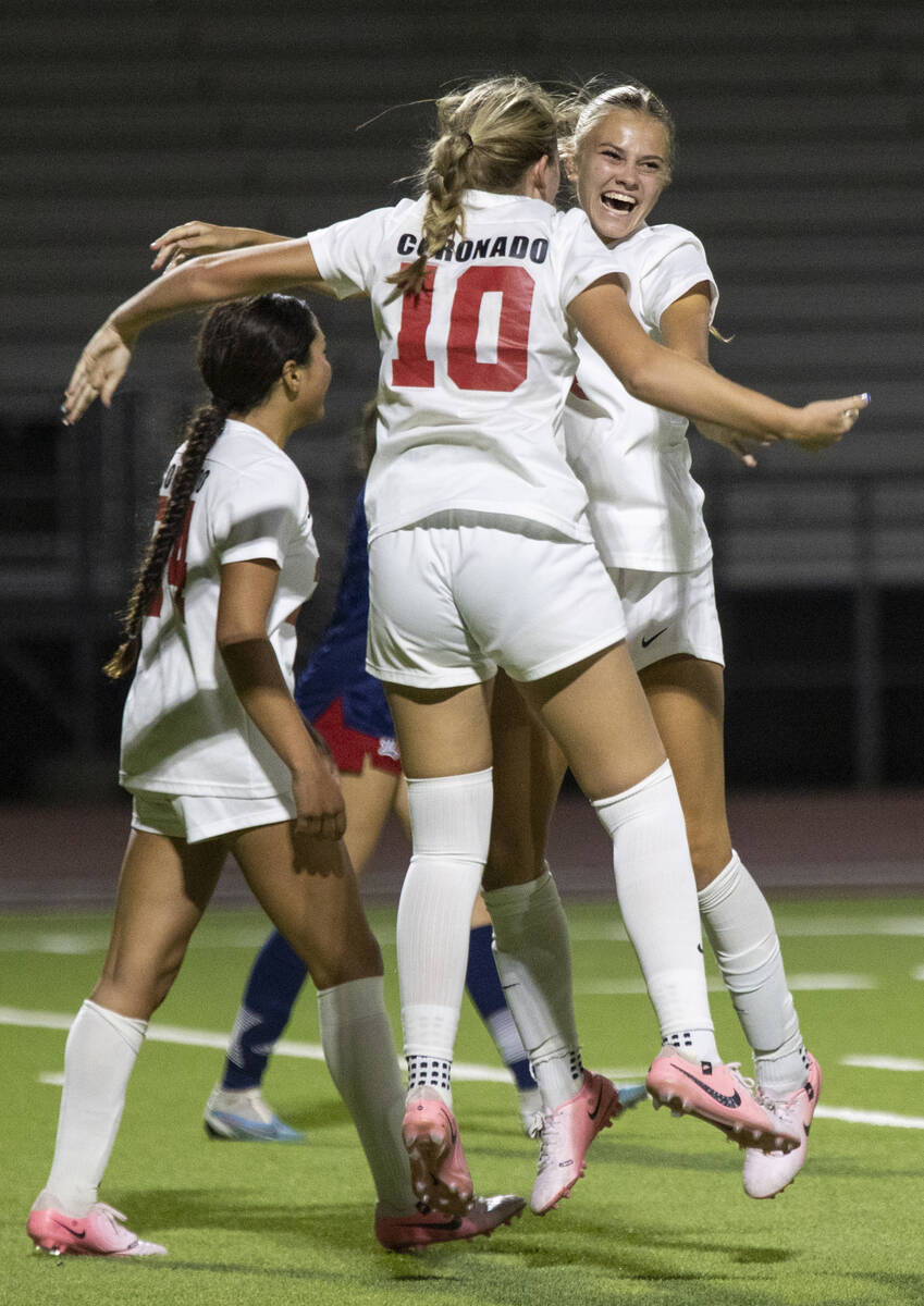 Coronado junior Ryan Neel (10) and junior Allison Kleiner (14) celebrate after a goal is scored ...