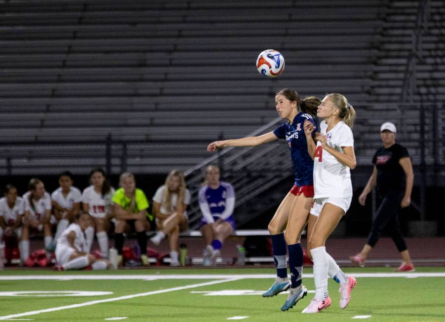 Liberty senior Nale'a Pomaikai (7) and Coronado junior Allison Kleiner (14) compete for the bal ...