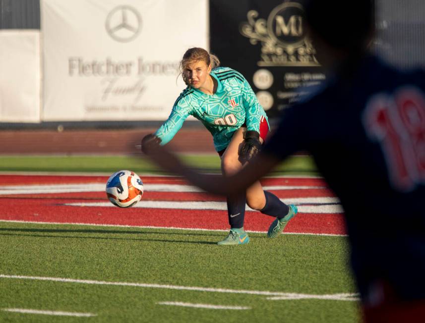 Liberty goalkeeper Brooke Kramer (00) passes the ball during the high school soccer game agains ...