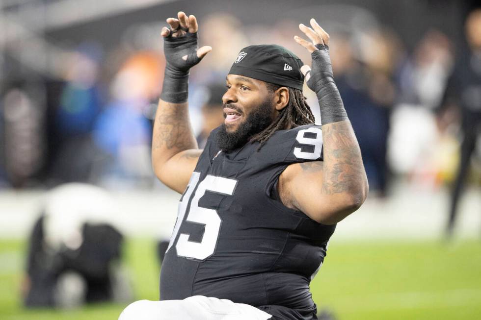 Raiders defensive tackle John Jenkins (95) stretches before an NFL game against the Los Angeles ...