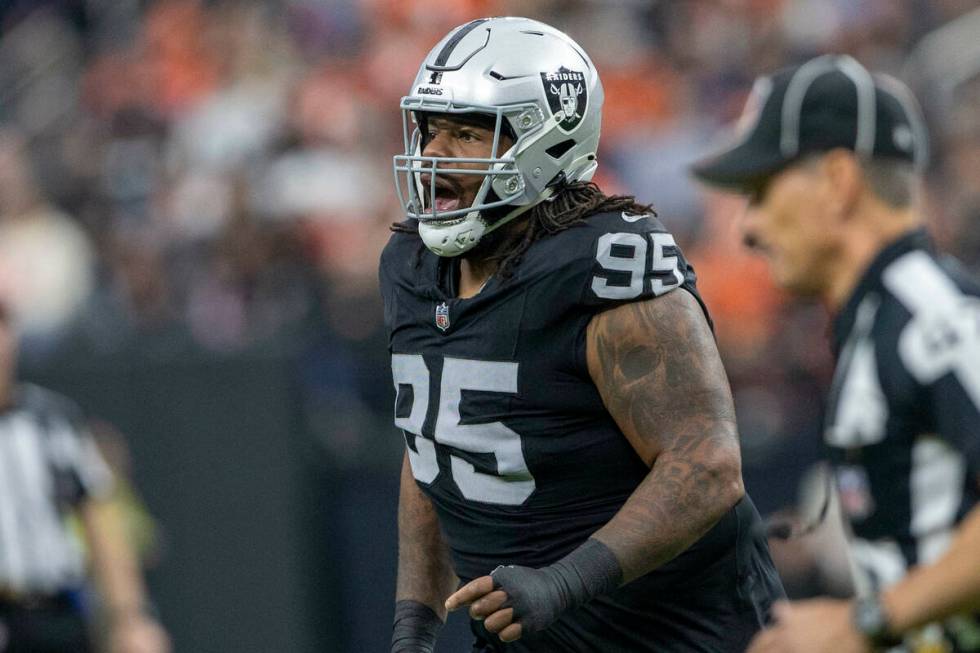 Raiders defensive tackle John Jenkins (95) comes off the field during the first half of an NFL ...