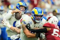 Los Angeles Rams quarterback Matthew Stafford (9) is sacked by Arizona Cardinals linebacker Den ...