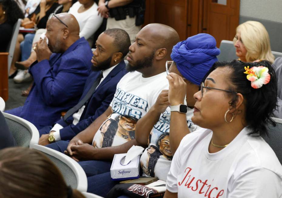 Gerry Jackson, far left, the father of a murder victim Destiny Nicole Jackson, his son Gary, ce ...