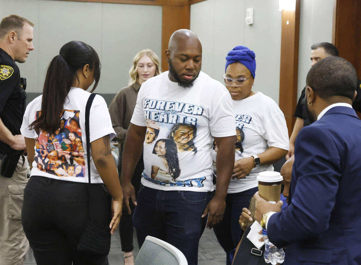 Gary Jackson, center, a brother of a murder victim Destiny Nicole Jackson, and family members a ...