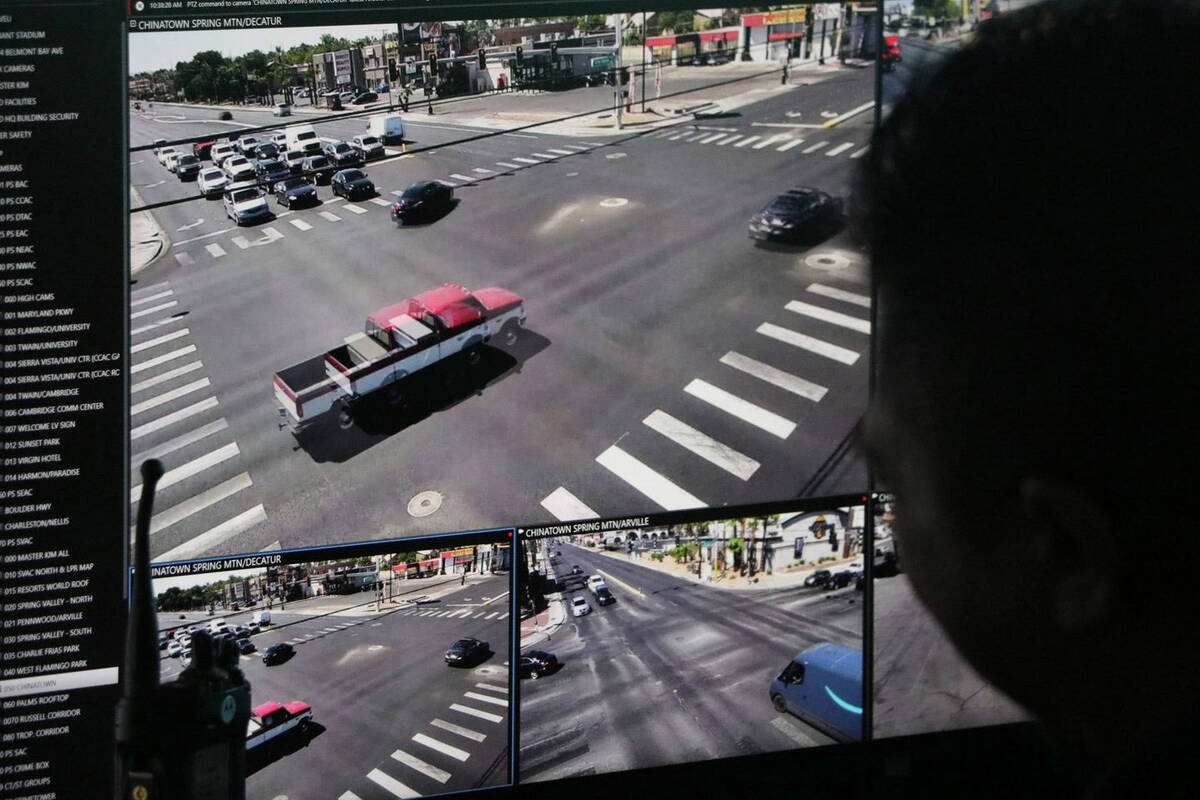 A Metropolitan Police Department staffer observes the Spring Mountain and Decatur intersection ...