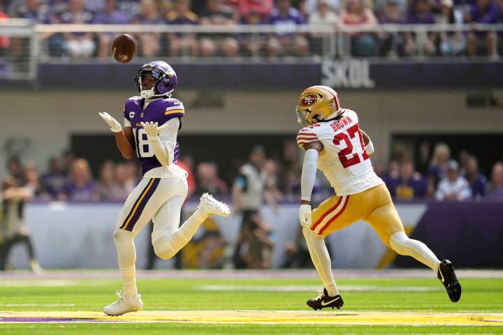 Minnesota Vikings wide receiver Justin Jefferson (18) catches a 97-yard touchdown pass over San ...