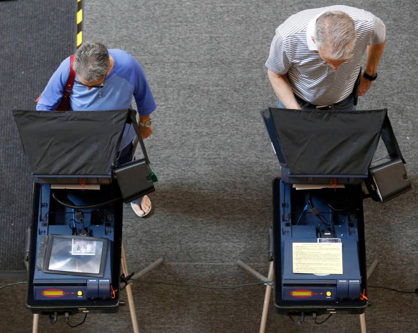 Henderson residents during early election day voting for the Clark County municipal election at ...