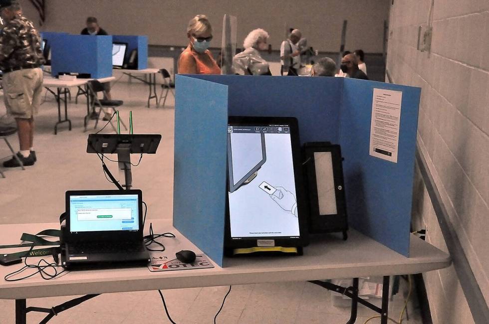 A voting booth is seen at the early voting site in Pahrump at Bob Ruud Community Center on Satu ...