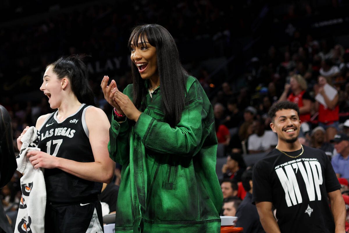 Las Vegas Aces center A'ja Wilson, who is resting before the playoffs, reacts in disbelief afte ...