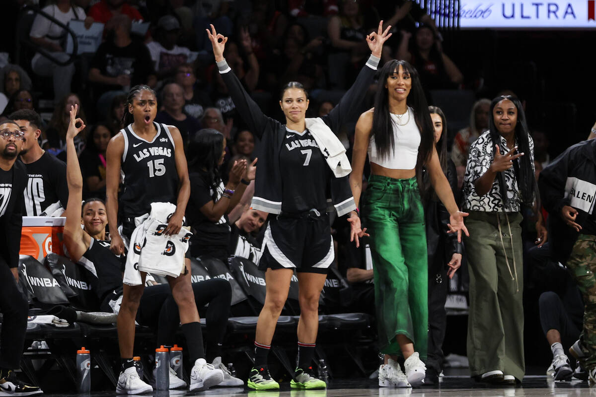 The Las Vegas Aces bench celebrates a score during the second half of a WNBA basketball game ag ...