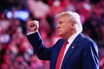 Republican presidential nominee former President Donald Trump raises his fist as he departs a c ...