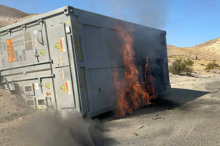 A 30-foot container, which was carrying lithium ion batteries, sits on the side of the road on ...