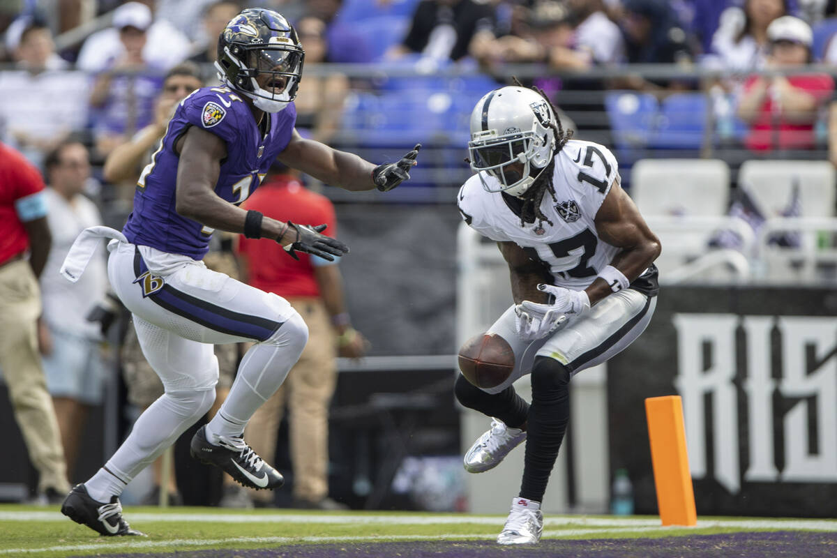 Raiders wide receiver Davante Adams (17) is unable to make a catch with Baltimore Ravens corner ...