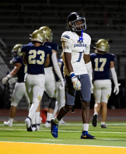 Desert Pines senior Ejuan Carter (1) slowly walks off the field after not converting on fourth ...