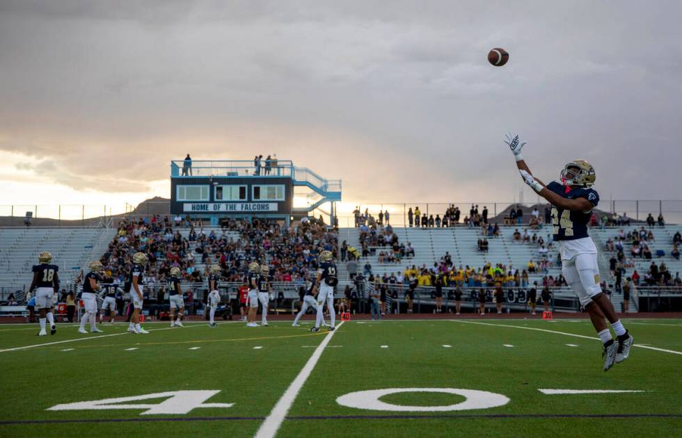 Foothill senior Lucas Allen (24) looks to catch a ball during a warm-up before the high school ...