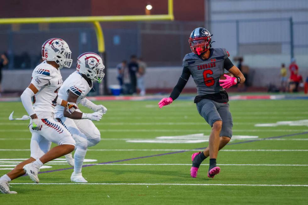 Coronado Wide Receiver JJ Buchanan (6) makes a reception during a football game between Liberty ...