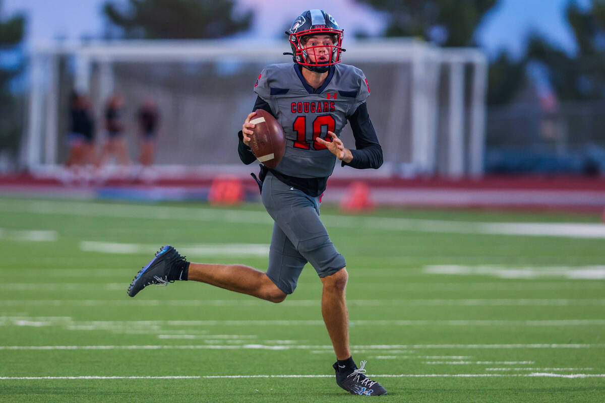 Coronado quarterback Aiden Krause (10) scrambles for a first down during a football game betwee ...