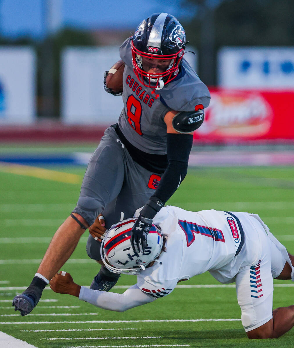 Coronado tight end Neville Roberts (8) runs off into the sidelines with the ball during a footb ...