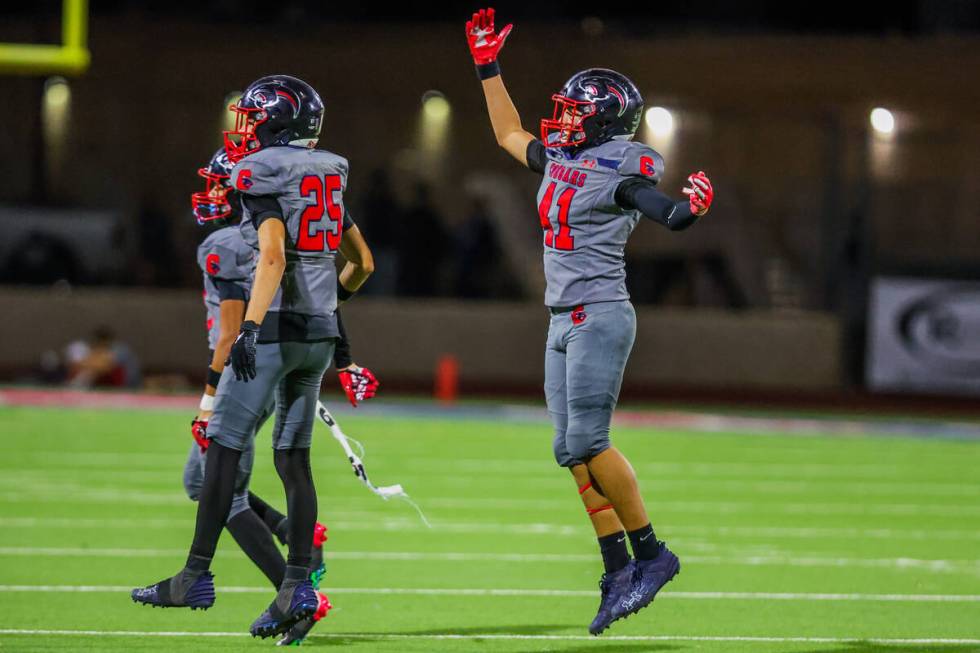 Coronado teammates celebrate winning a football game between Liberty and Coronado at Coronado H ...