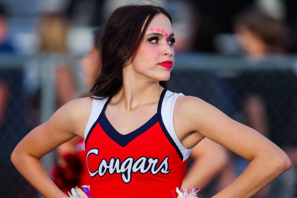 A Coronado cheerleader watches game action during a football game between Liberty and Coronado ...