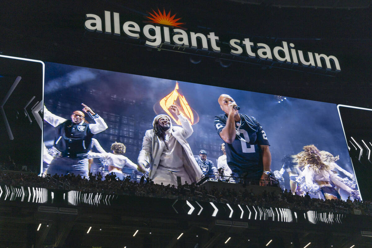 Warren G, Marshawn Lynch and Too Short perform during halftime of an NFL game between the Raide ...