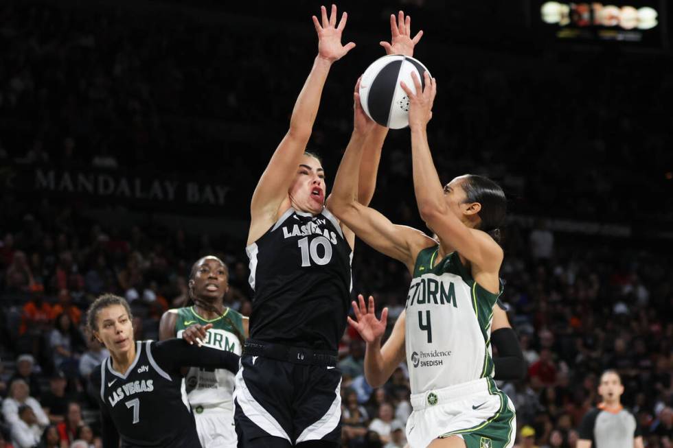 Las Vegas Aces guard Kelsey Plum (10) defends while Seattle Storm guard Skylar Diggins-Smith (4 ...