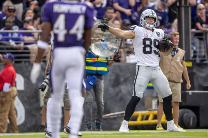 Raiders tight end Brock Bowers (89) motions for a first down after a catch during the second ha ...