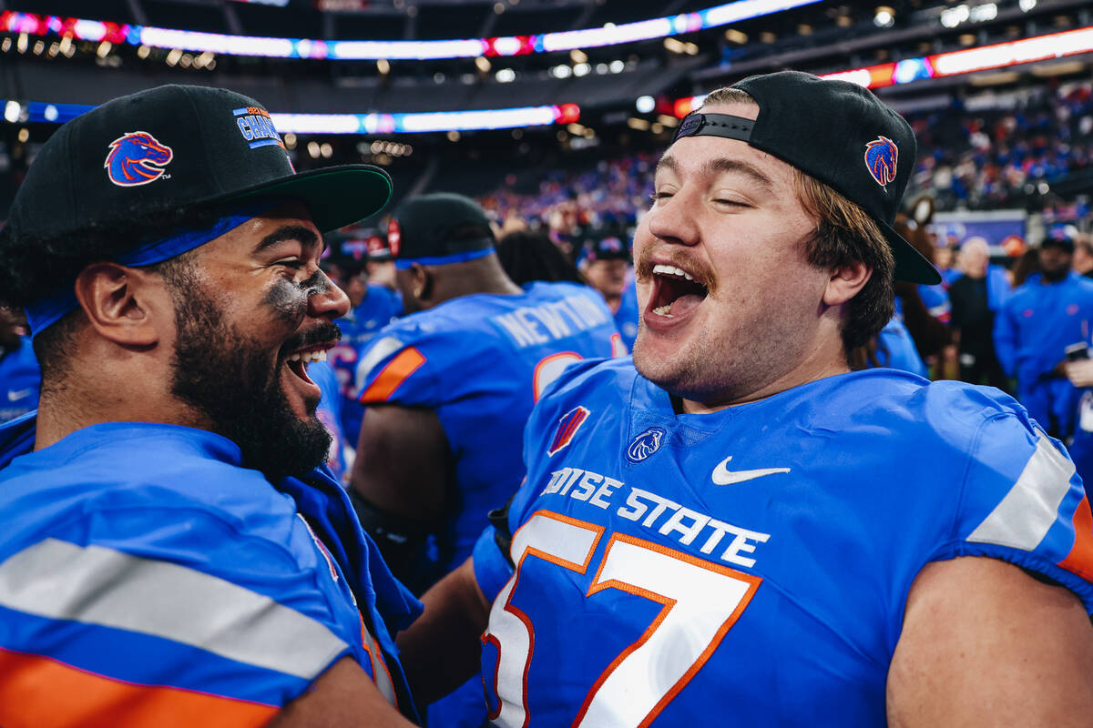 Boise State players celebrate winning the Mountain West championship game at Allegiant Stadium ...