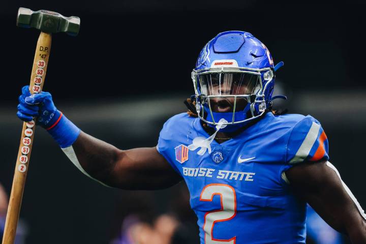 Boise State running back Ashton Jeanty (2) carries a hammer out of the tunnel before the Mounta ...