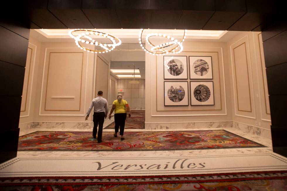 Employees walk in the new entrance to the Skybridge at the Paris Las Vegas, Friday, Sept. 20, 2 ...