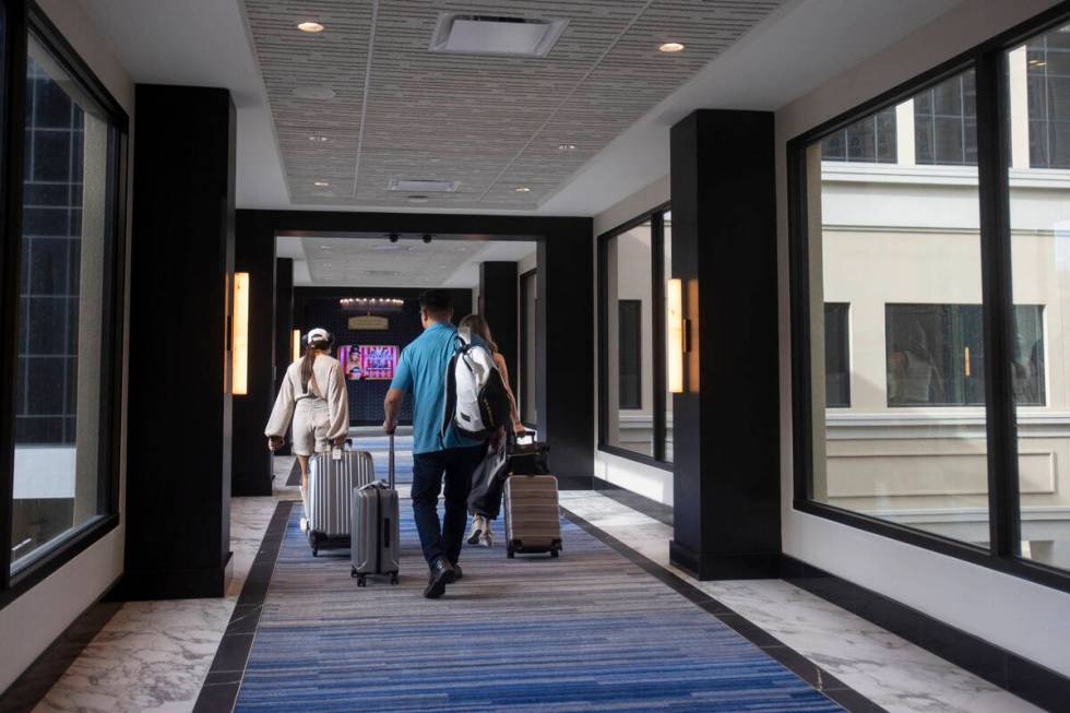 Customers walk through the new Skybridge at the Paris Las Vegas, Friday, Sept. 20, 2024, in Las ...