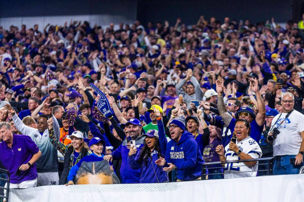 Washington Huskies fans celebrate another score against Oregon Ducks during the first half of t ...