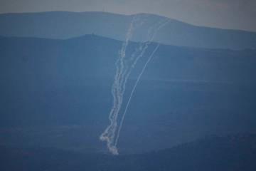 Israeli Iron Dome air defense system fires to intercept rockets that were launched from Lebanon ...