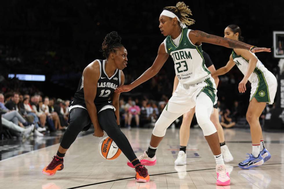 Las Vegas Aces guard Chelsea Gray (12) dribbles against Seattle Storm guard Jordan Horston (23) ...