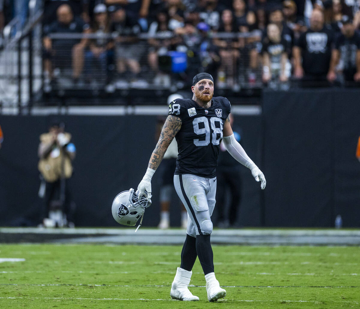 Raiders defensive end Maxx Crosby (98) walks off the field after another Carolina Panthers scor ...