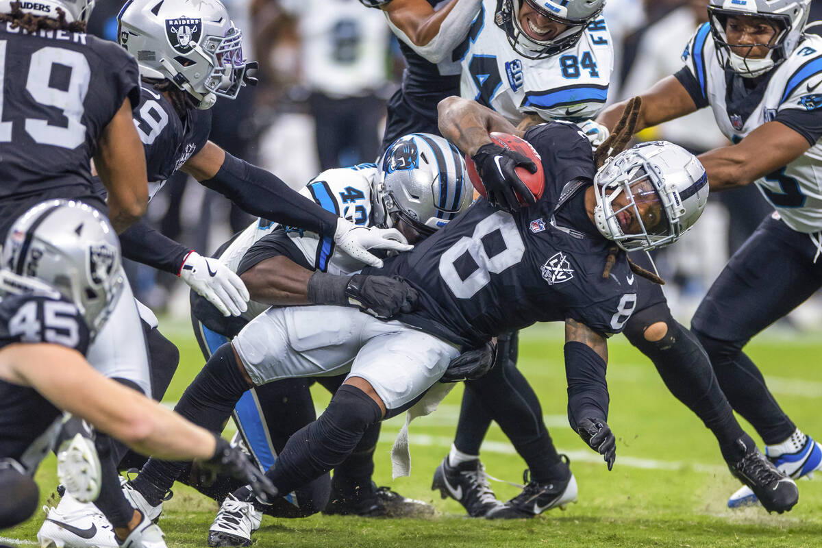 Raiders running back Ameer Abdullah (8) is taken down by Carolina Panthers linebacker Charles H ...