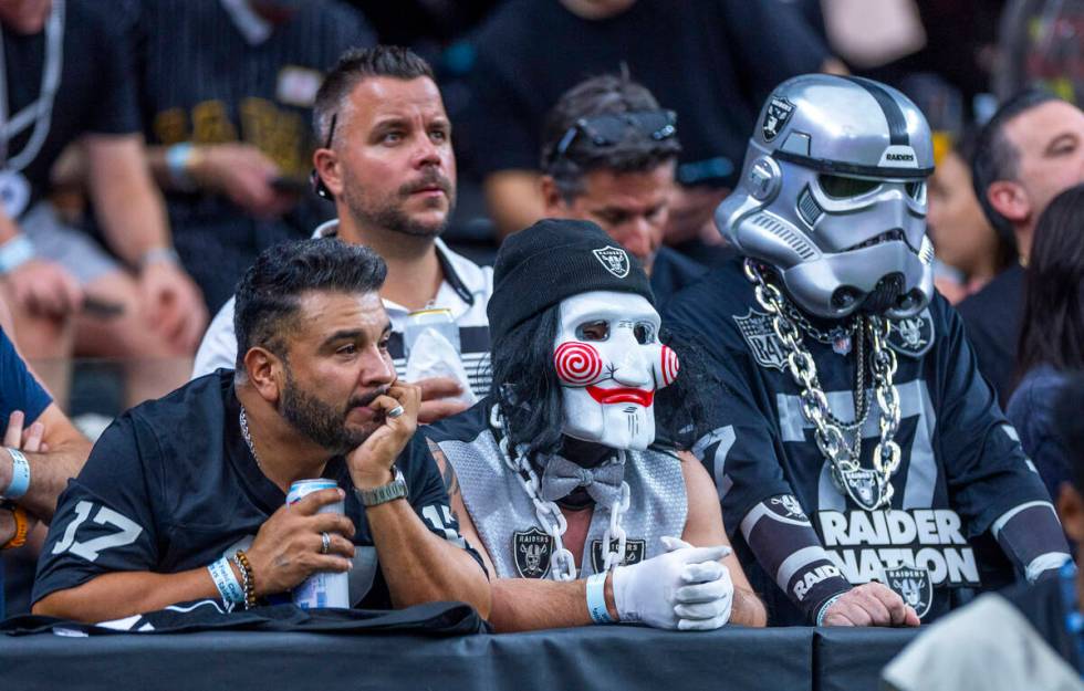 Raiders fans sit dismayed as the Carolina Panthers dominate during the first half of their NFL ...