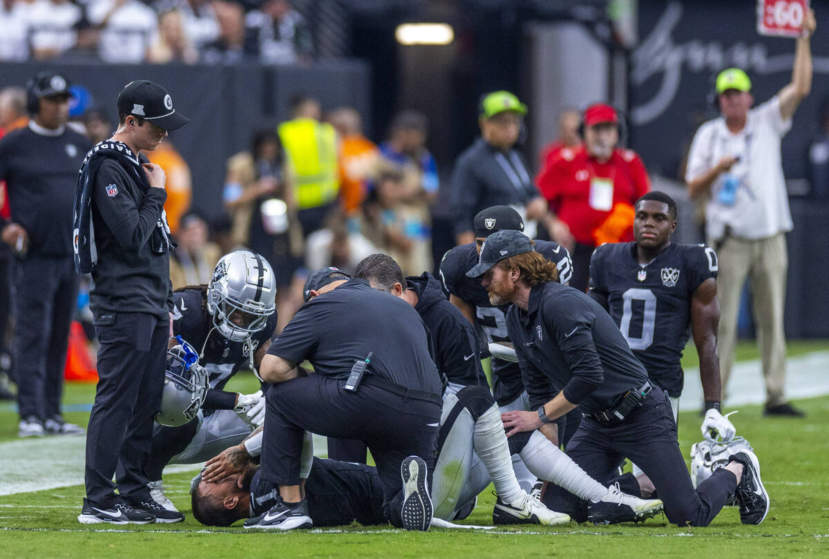 Raiders safety Marcus Epps (1) is down with a possible knee injury against the Carolina Panther ...