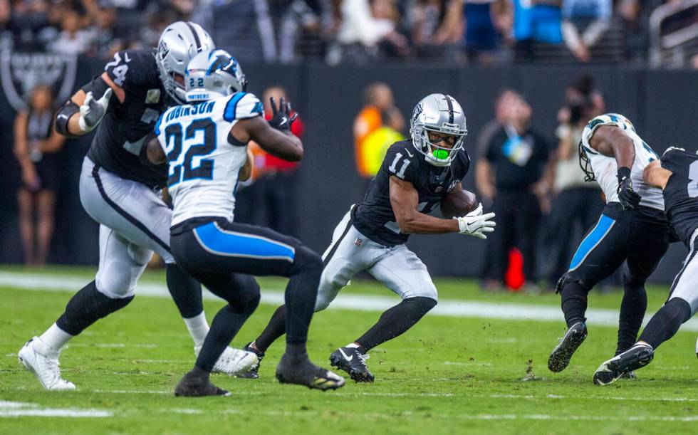 Raiders wide receiver Tre Tucker (11) looks for more yards after a reception against the Caroli ...