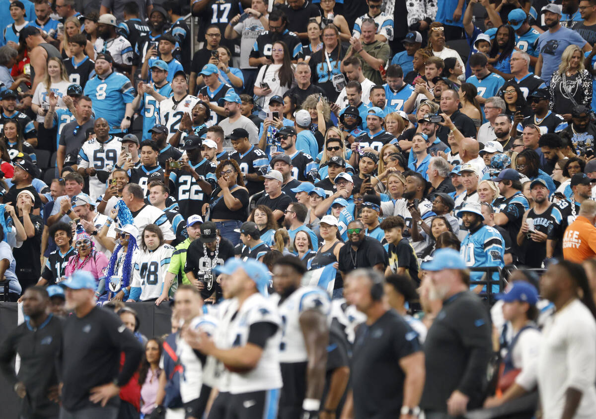 Carolina Panthers fans cheer for their team during an NFL football game against Raiders at Alle ...