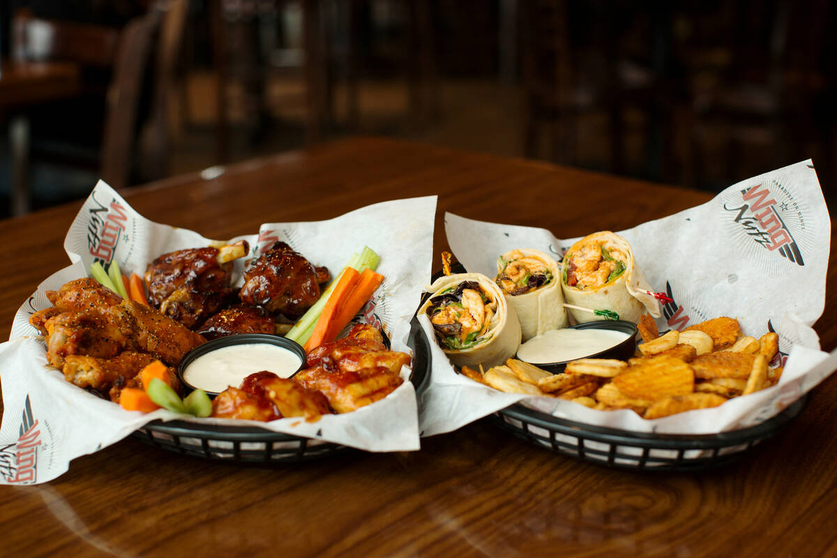 Bone-in and boneless wings and a buffalo chicken wrap with baked buffalo chips from the new Win ...