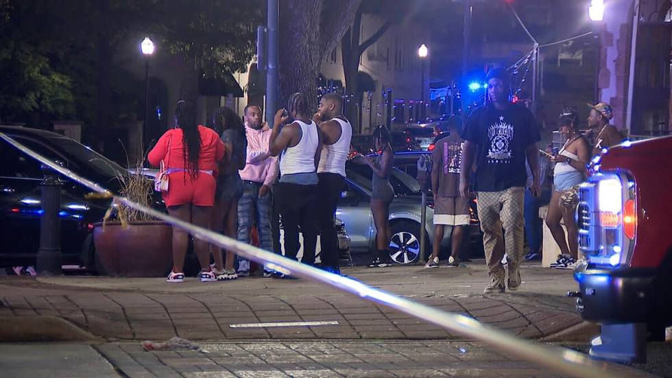 This image provided by WBMA shows bystanders near the scene of a shooting in Birmingham, Ala., ...