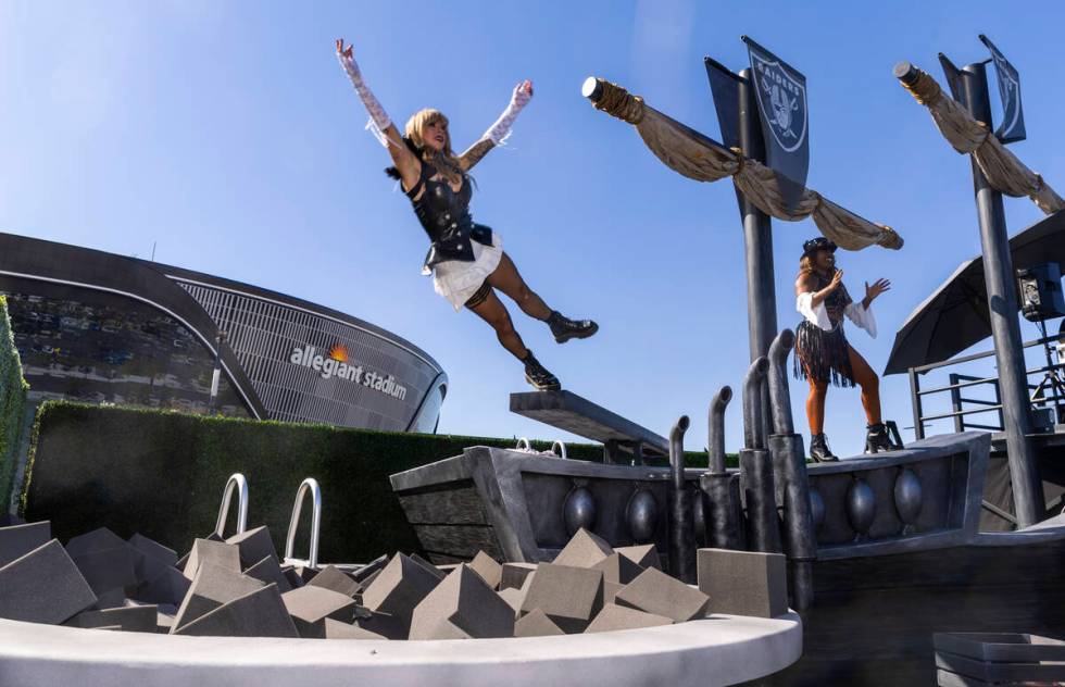 A performer falls off the plank in the new Raiders Pregame Masqueraid venue in the tailgate bef ...