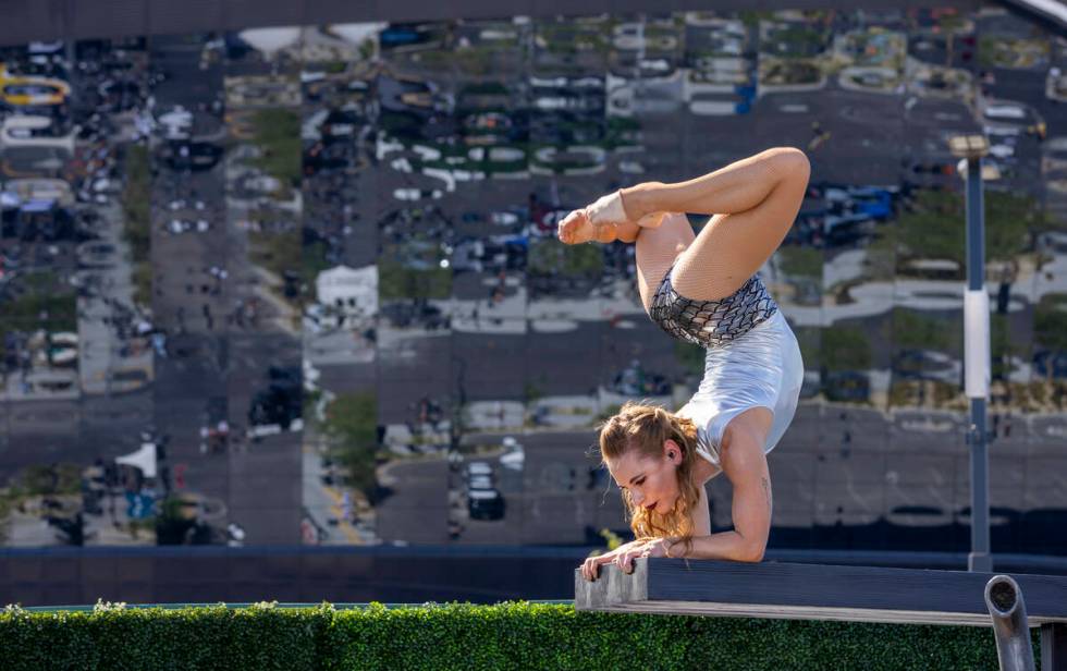 A contortionist performs for fans in the new Raiders Pregame Masqueraid venue in the tailgate b ...